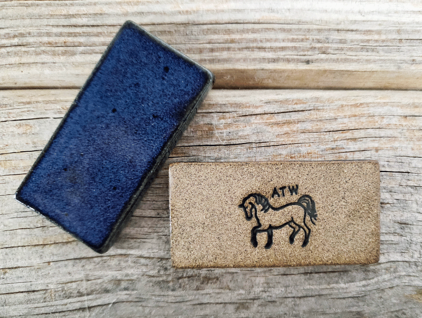 Two dominoes on a wooden surface