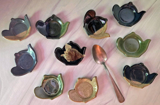 Assortment of stoneware tea bag caddies in a variety of glazes.