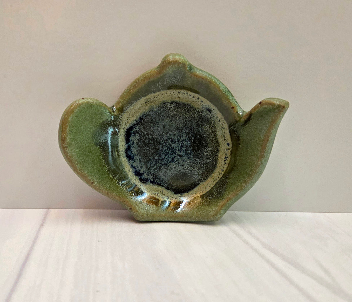 Stoneware tea bag caddy in crema verde glaze.