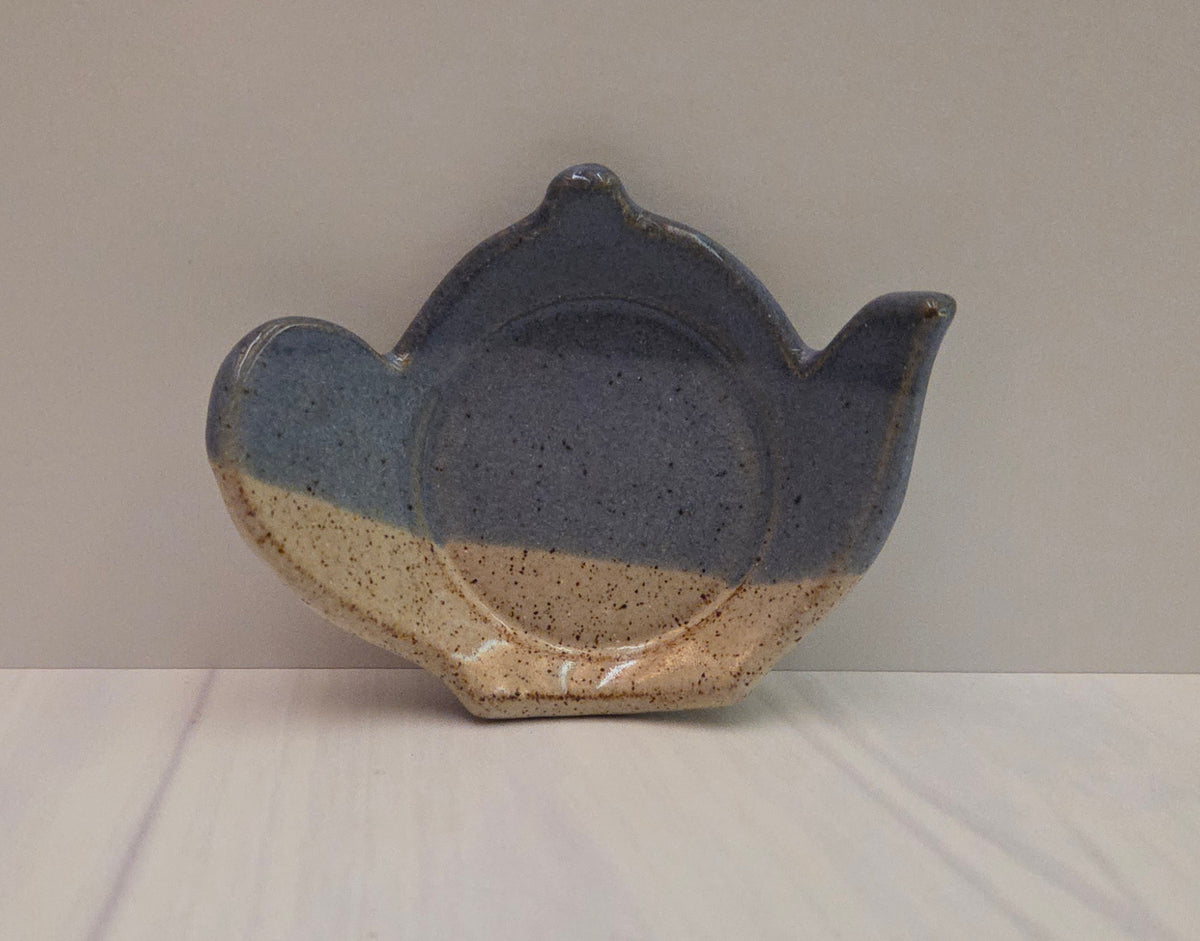Stoneware tea bag caddy in purple and eggshell glaze.